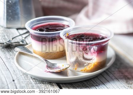 Sweet desssert. Cheesecake cup on plate.