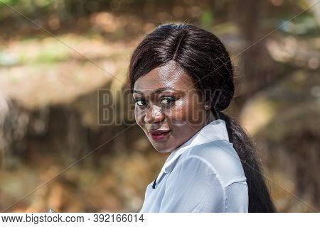 Africa Woman At Beach With White  Shirt After Bath In Axim Ghana West Africa.