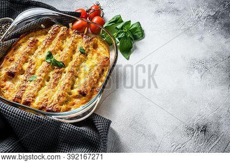 Stuffed Cannelloni With Bechamel Sauce. Pasta Baked With Beef Meat, Cream Sauce, Cheese. Gray Backgr
