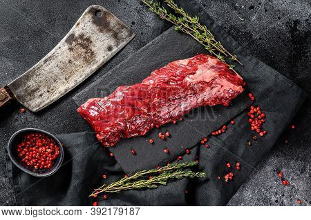 Raw Strip Vegas Beef Steak With Pink Pepper And Thyme. Black Background. Top View