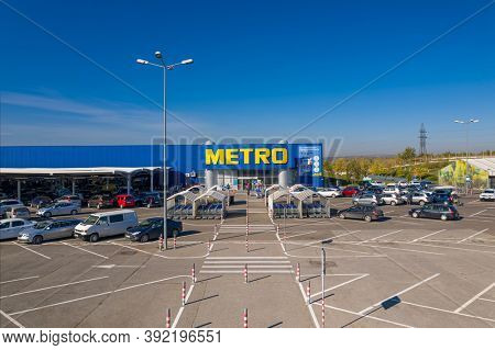 Chisinau, Moldova - October, 2020: Metro retail store, large shopping mall of household and food goods with parking, aerial view, copyspace