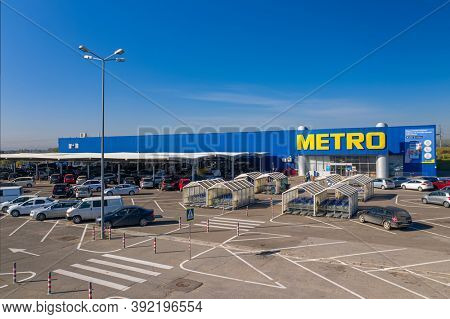 Chisinau, Moldova - October, 2020: Metro retail store, large shopping mall of household and food goods with parking, aerial view, copyspace