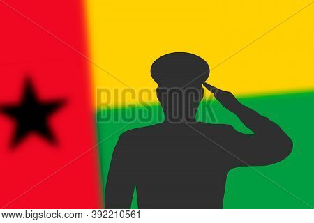 Solder Silhouette On Blur Background With Guinea-bissau Flag.