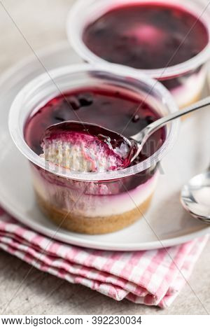 Sweet desssert. Cheesecake cup on plate.
