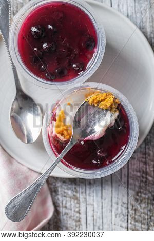 Sweet desssert. Cheesecake cup on plate. Top view.