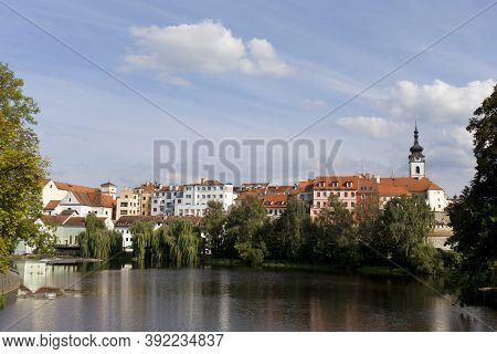 Colorful Medieval Town Pisek Above The River Otava With The Deanery Church, Czech Republic