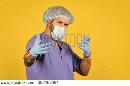 New Viruses Detected All The Time. Beginning Of Virus Outbreak. Man Doctor Uniform Yellow Background