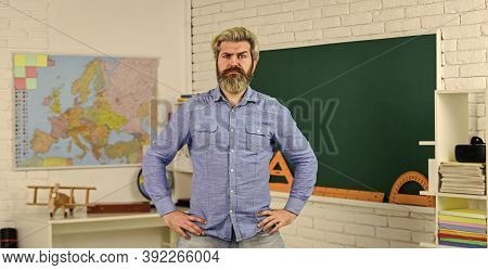 School Subject. Basic Education. History And Geography. Science Concept. Mature Bearded Teacher In C