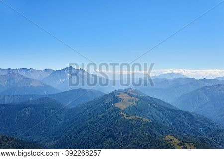 View From The Top Of Mount Oshten To The Distant Ranges Of The Caucasus Mountains In A Blue Haze
