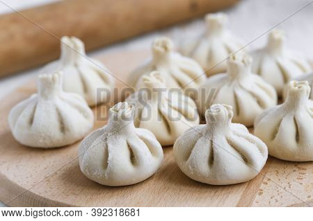 Baked homemade  cheese pie on wooden background. Bulgarian banitsa, Georgian khachapuri, Greek tirop