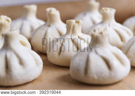 Baked homemade  cheese pie on wooden background. Bulgarian banitsa, Georgian khachapuri, Greek tirop