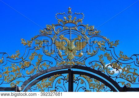 Golden Two-headed Eagle And Crown On The Gates Of The Great Catherine Palace. Russia Pushkino 08/17/
