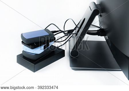 Multiple External Hard Drives Connected To A Monoblock On A White Background.computer With Hard Driv