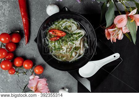 Bowl Of Chicken Noodle On Gray Concrete Background