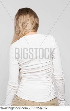 Caucasian Female In White Top With Scoliosis, Back View. Rachiocampsis, Kyphosis Curvature Of The Sp