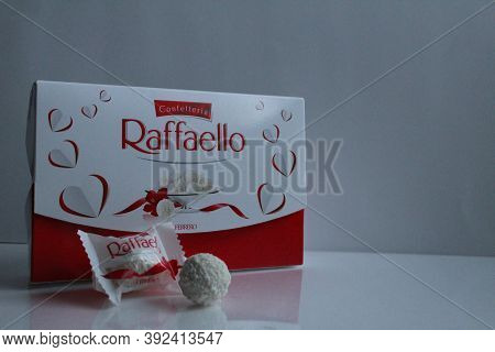 Raffaello\'s Candy And Gift Box Stands On A White Gray Light Background Side View Of Copy Space