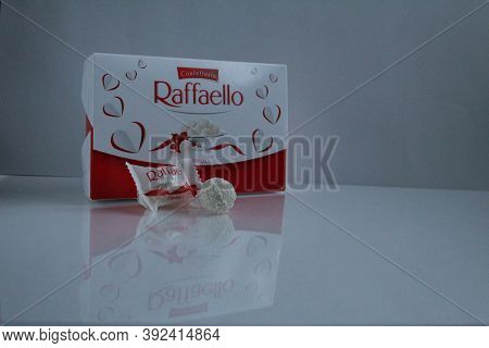 Raffaello\'s Candy And Gift Box Stands On A White Gray Light Background Side View Of Copy Space