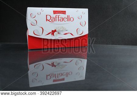 Candy And A Square Rectangular Gift Box By Raffaello Stands On A Black Background Side View Of Copy 
