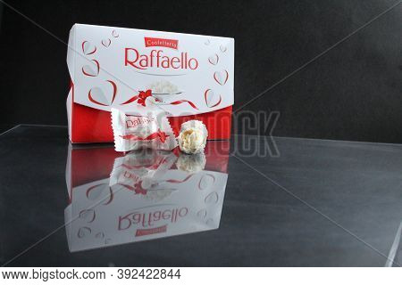 Candy And A Square Rectangular Gift Box By Raffaello Stands On A Black Background Side View Of Copy 