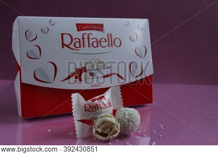 White Candies Round And Halves In The Background Is A Square Rectangular Gift Box Raffaello Stands O