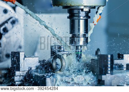 Vertical Cnc Steel Milling Process With External Water Coolant Streams, Splashes And A Lot Of Metal 