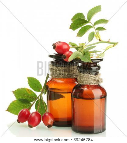 Medycyna butelek z biodra róż, na białym tle