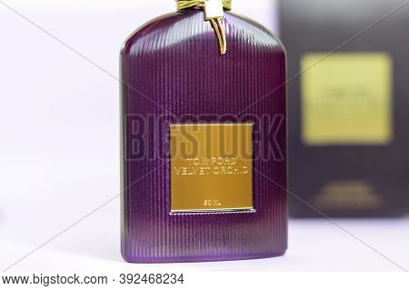 Tom Ford Velvet Orchid Fragrance Perfume Bottle Lies On Light Lilac Background. Tom Ford Is American