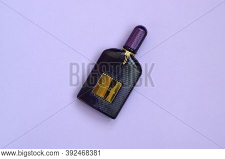 Tom Ford Velvet Orchid Fragrance Perfume Bottle Lies On Light Lilac Background. Tom Ford Is American
