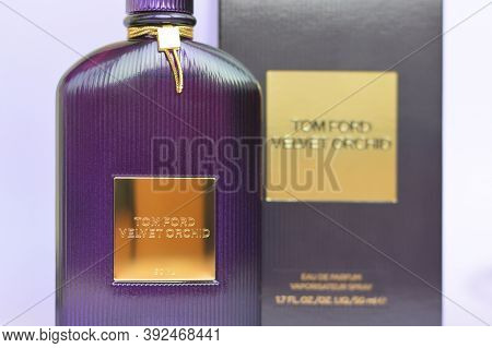 Tom Ford Velvet Orchid Fragrance Perfume Bottle Lies On Light Lilac Background. Tom Ford Is American