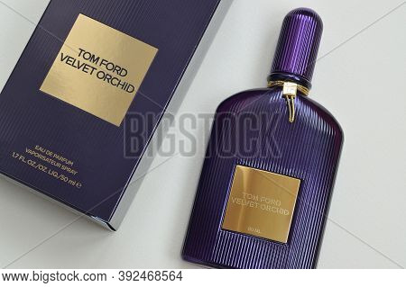 Tom Ford Velvet Orchid Fragrance Perfume Bottle Lies On Light Lilac Background. Tom Ford Is American