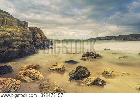 Serantes Beach Landscape With Rocks And Sea Water In Asturias, Spain