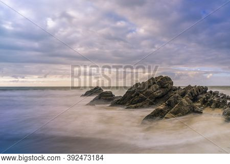 Serantes Beach Landscape With Rocks And Sea Water In Asturias, Spain