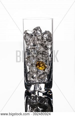Crystals Of Ice In A Glass With Water On A Glass Background