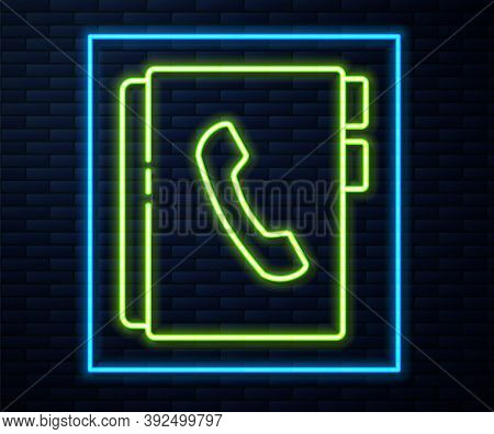 Glowing Neon Line Address Book Icon Isolated On Brick Wall Background. Notebook, Address, Contact, D