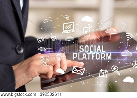 Close-up Of A Person Using Social Networking with SOCIAL PLATFORM inscription