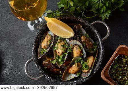 Classic French Meal Moules Marinière  Marinara Mussels With Garlic, Sauce, Lemon And Parsley.