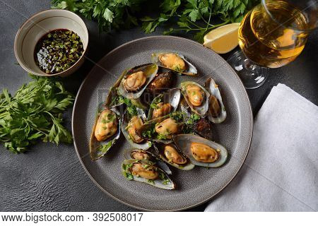Classic French Meal Moules Marinière  Marinara Mussels With Garlic, Sauce, Lemon And Parsley.