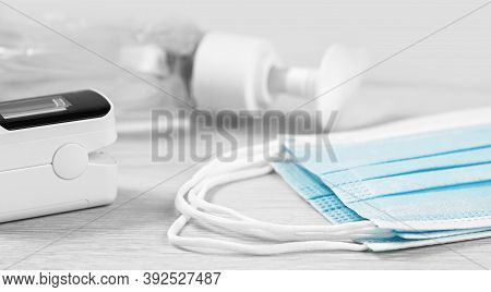 Medical Concept. Pulse Oximeter, Sanitizer And Face Masks. Pneumonia Prevention And Cure, Flu Sesion