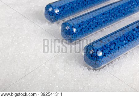 White Plastic Beads On Wood  Background, Polymers Bead Or Polymer Resin, Polymer Pallet, Product Fro