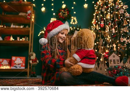 Portrait Of Cutel Little Child Girl Playing With Taddy Bear, New Year Holiday Concept.