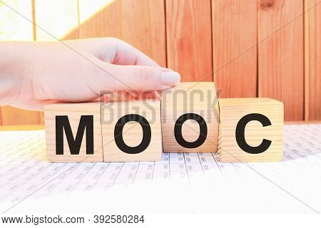 Word Mooc On Wooden Blocks, White Background, Business Concept. Business And Finance