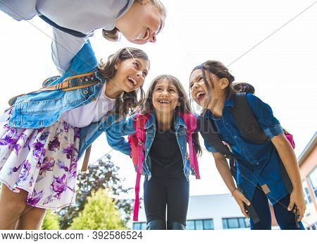 Some Nice Kids On The School Background Having Fun
