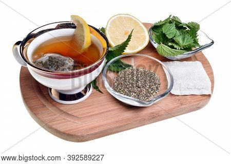Fresh Healthy Nettle Plant, Lemon And Dried Herbs Isolated On A White Background Good For Coronaviru