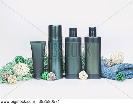 Set Of Products For Personal Hygiene, Body Care And Beauty In Dark Green Bottles. Grainy Testure On 
