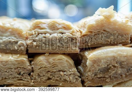 Baklava Pieces On Display. Rich, Sweet Pastry Made Of Layers Of Filo Filled With Chopped Nuts, Sweet