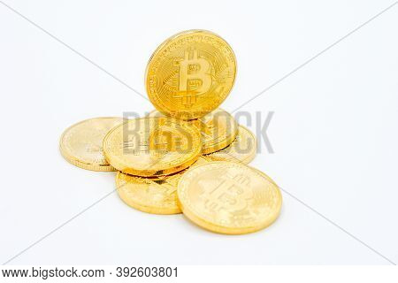 Bitcoin - The Future Curreny: Golden Bitcoin Coin On A White Background. The Future Cryptocurrency. 