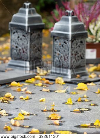Lanterns On Granite Tombstone. Old Town Graveyard In Forest Park. 24th Of October 2020. Hronov, Czec
