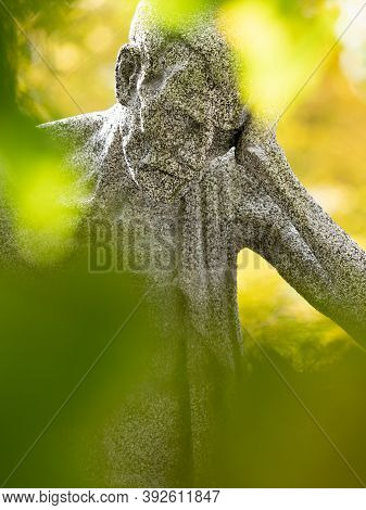 Skinny Man Head  Statue. Old Sad Man Thinking And Reads Memories In Gravetone. 24th Of October 2020.