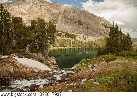Creek Flowing Into September Morn Lake In Beartooth Mountains, Montana