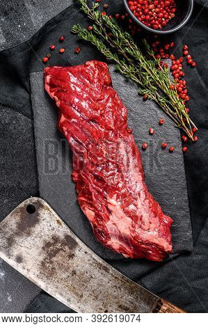 Raw Strip Vegas Beef Steak With Pink Pepper And Thyme. Black Background. Top View